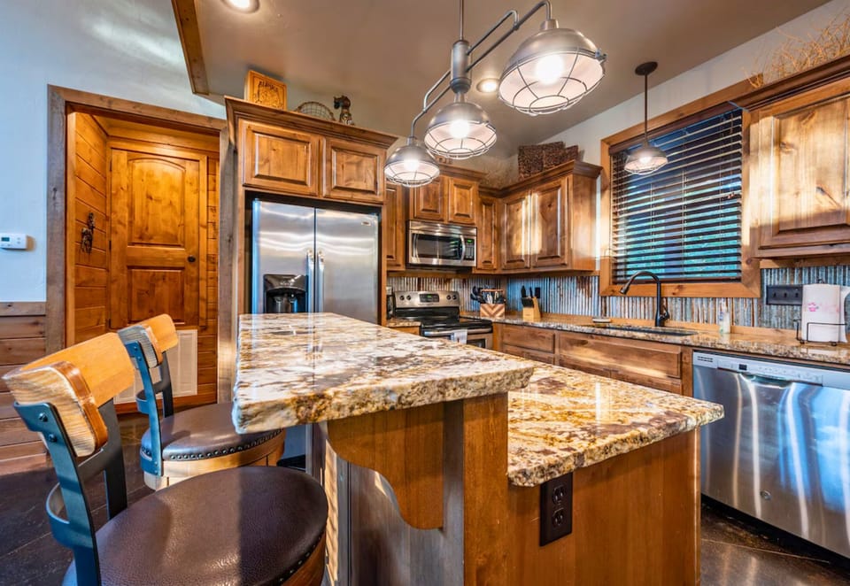 The spacious kitchen island is perfect for meal prep and casual dining, making cooking a pleasure.