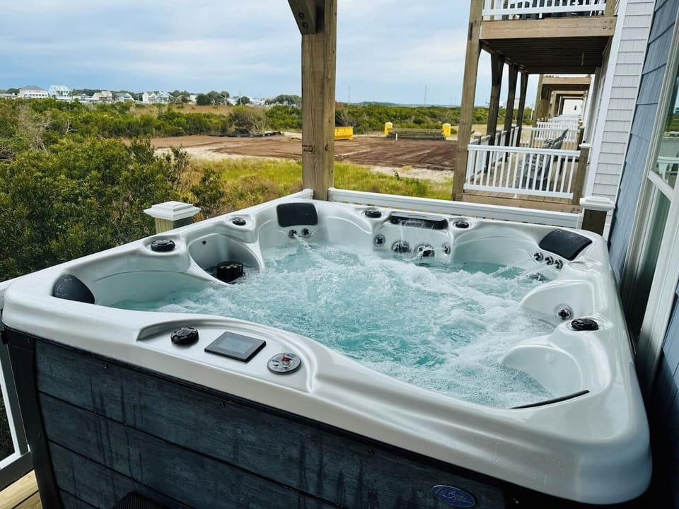 Soak in this hot tub with a scenic outdoor view—pure relaxation.