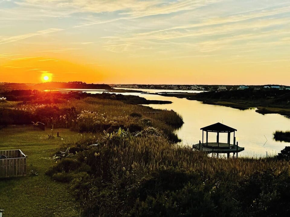 Golden-hour views over the peaceful sound—your backdrop for unforgettable evenings.
