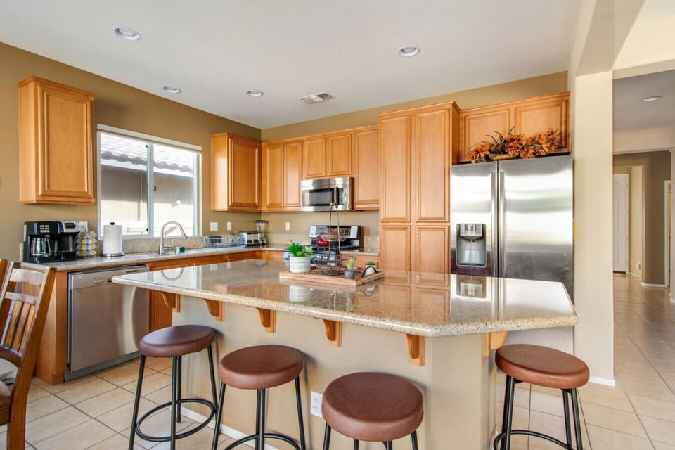 Fully stocked kitchen  with Barstool seating good for 2.