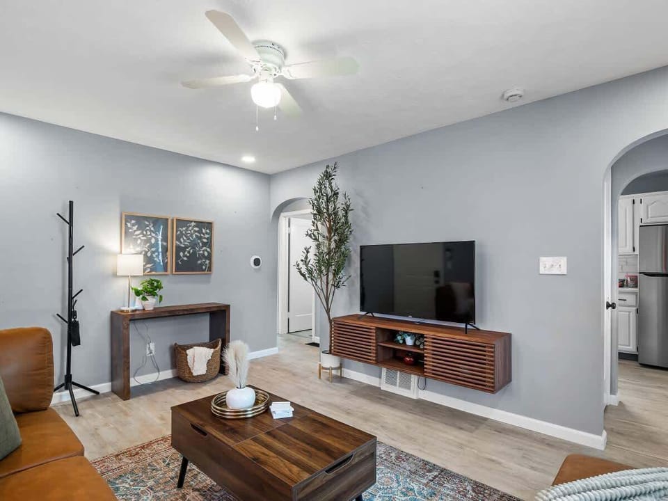he bright and welcoming living room invites you to unwind.