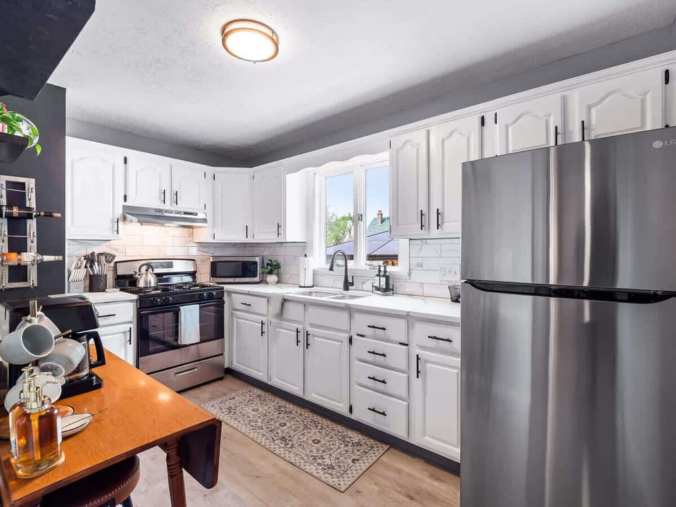 The kitchen and dining area are open and airy, providing a welcoming space for gatherings.