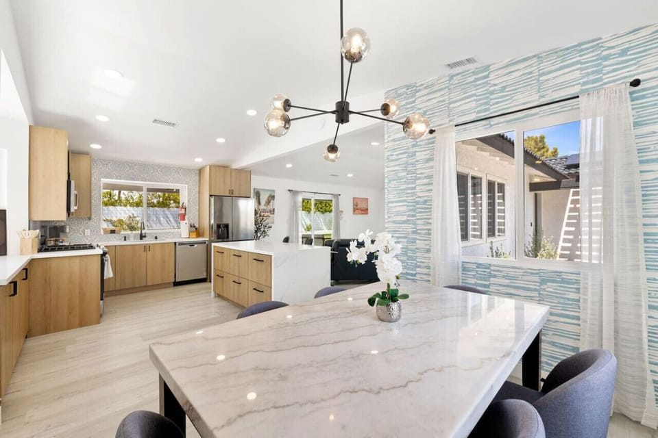 Spacious open kitchen & living area w/ clean lines and easy sightlines to the outdoors.