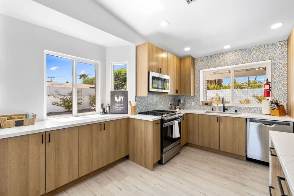 Modern kitchen w/ ample counter space and bright finishes, ready for casual meals or shared cooking moments.