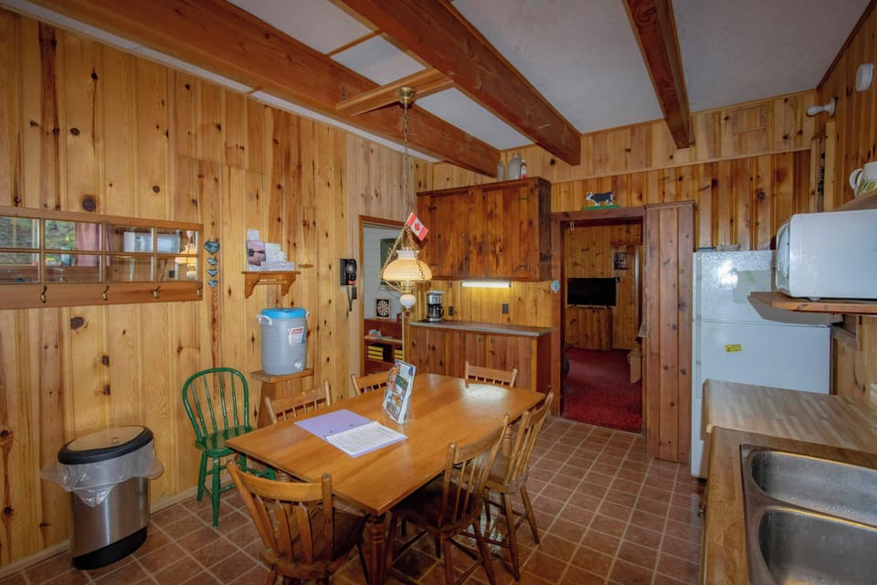 Walk into the kitchen from the outside. Cabin is directly outside the kitchen.