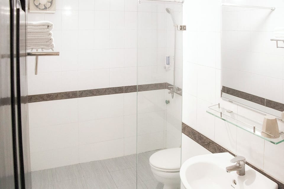 Shower, free toiletries, hair dryer, slippers