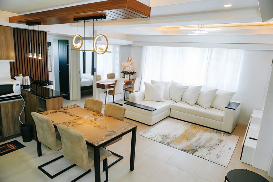 Premier Condo | Living area | 55-inch flat-screen TV with digital channels, Netflix