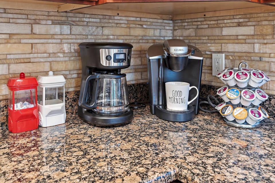 Start your mornings right with a dedicated coffee nook featuring both a drip coffee maker and a Keurig.