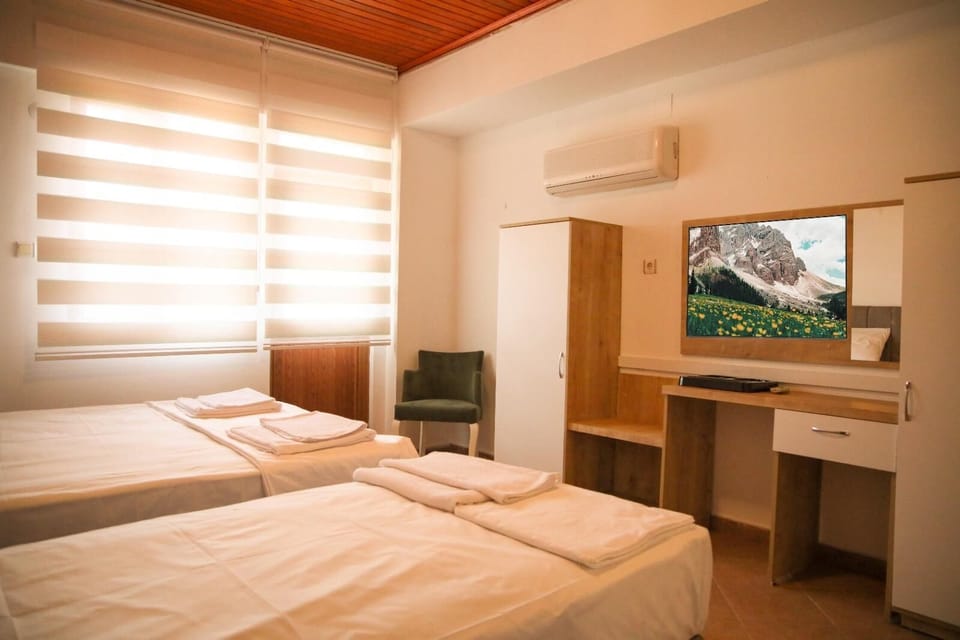 Family Triple Room, Balcony, Lake View | Desk, free WiFi