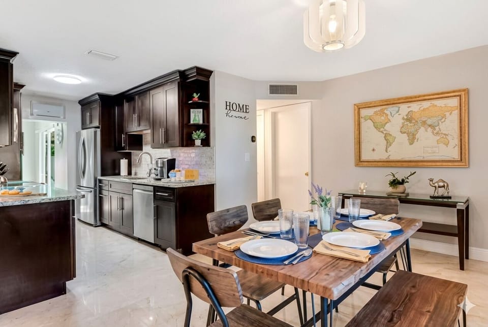 Spacious dining room with sleek table for family meals and gatherings.
