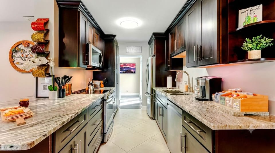 Modern kitchen with sleek appliances and essentials for easy meal prep.
