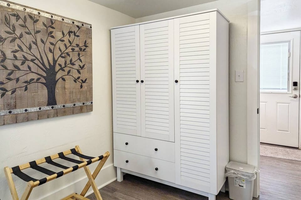 Wardrobe and suitcase rack in the front queen bedroom