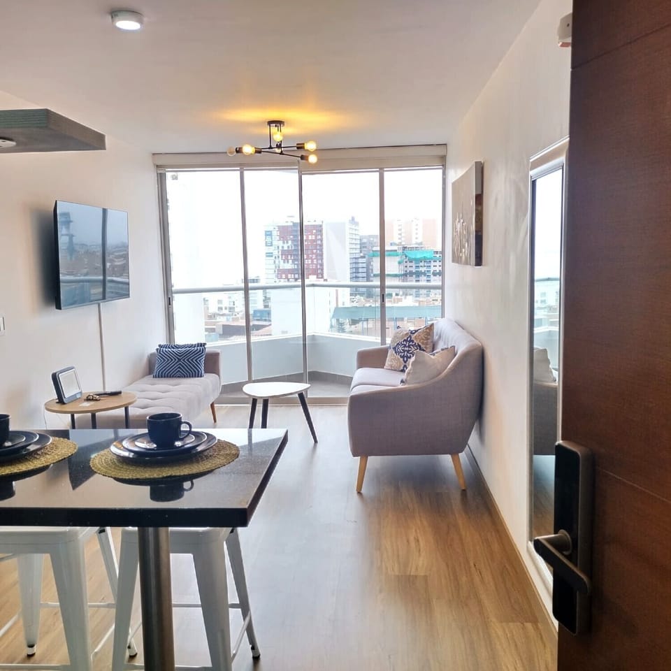 Equipped kitchen and living room w sofa, 50-inch SmartTv and private balcony