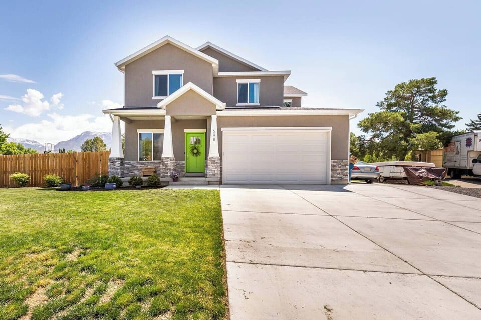 Front of our home, with a bright green door - you can't miss it!Lots of parking space.