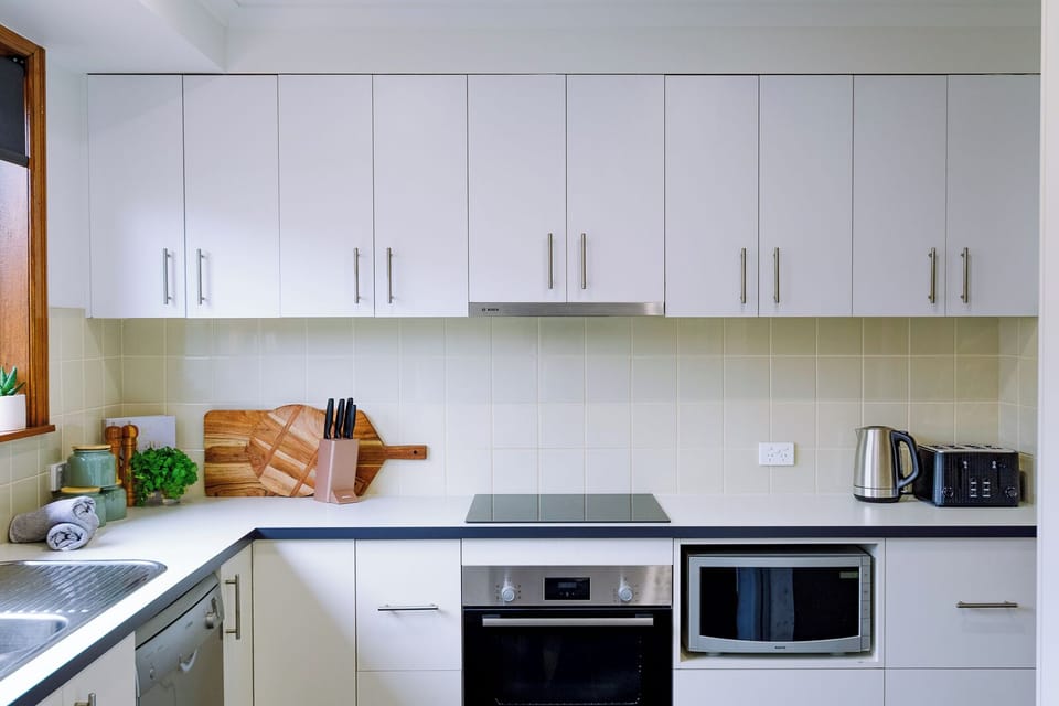 Fully equipped kitchen with oven, stove, fridge, coffee machine and more