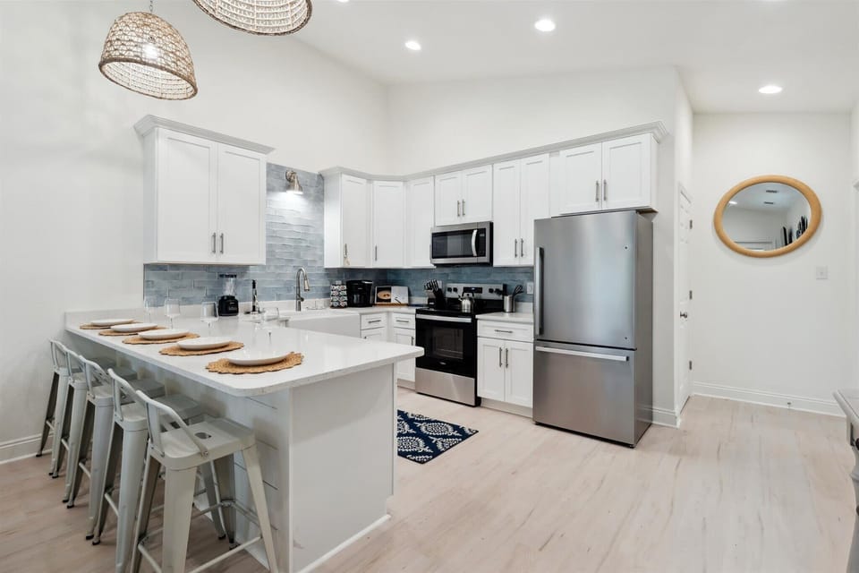 Five barstools provide ample seating for guests to gather, dine, and enjoy great company.