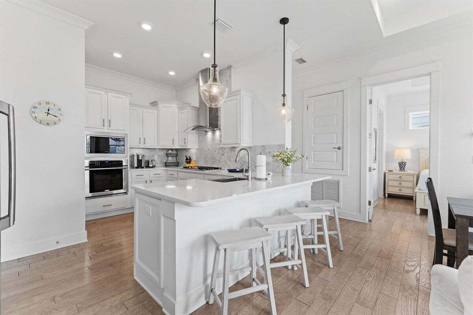 A well-appointed kitchen with bar seating, perfect for casual meals and entertaining guests.