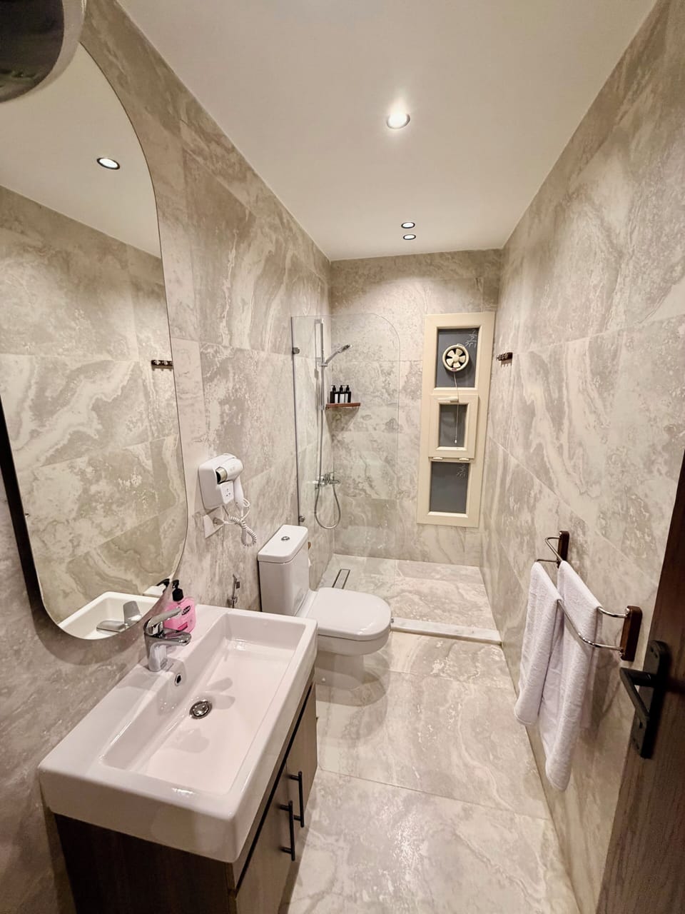 Separate tub and shower, hair dryer, slippers, bidet