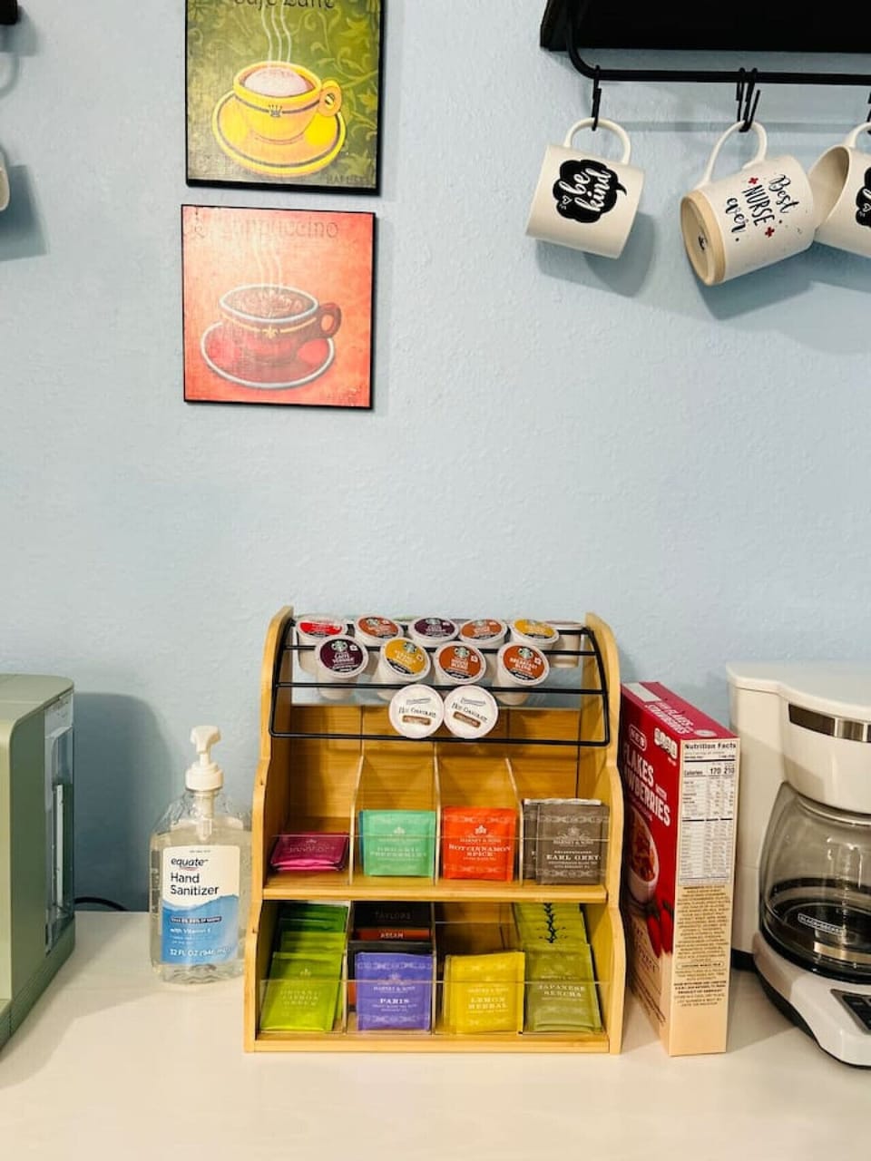 **Complimentary coffee & tea station.** Help yourself to a selection of coffee, tea, and creamer—perfect for easy mornings or a quick pick-me-up during your stay.