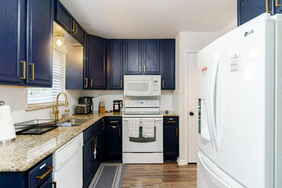 Modern appliances, generous counter space, and thoughtful touches make cooking simple and comfortable—whether it’s a quick meal or a relaxed night in.