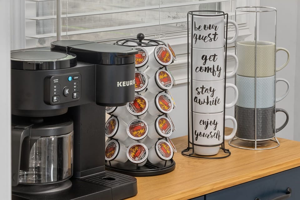 Cozy coffee station with Keurig, pods, and mugs for a guest-ready stay