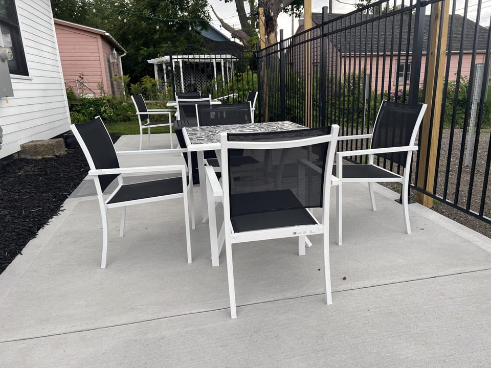 Victorian outdoor space with table top fire pit