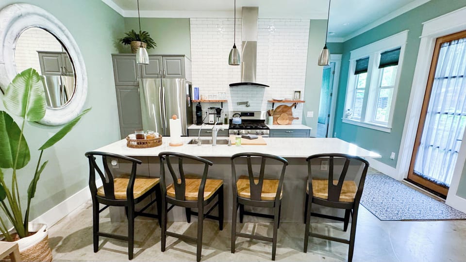 The kitchen island seats four generously, with room left over for meal prep and/or playing games. Cook to your heart’s content in the well-stocked kitchen, including a gas range, oven, microwave and full fridge. 