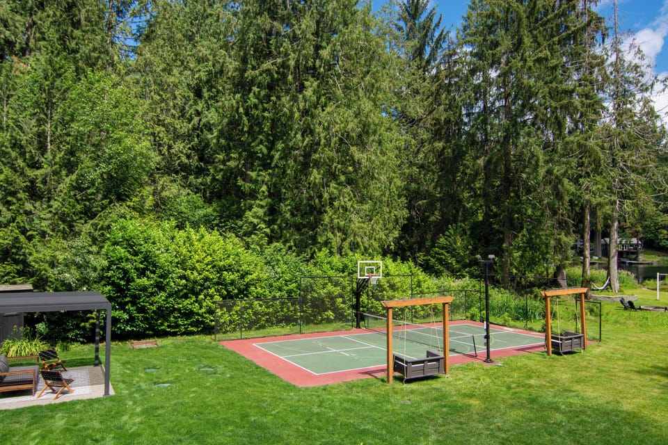 Pickleball court and large lawn. 