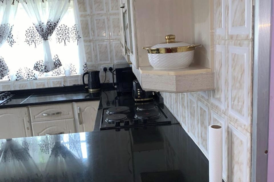 Part of the kitchen with all necessary plates and cutlery 