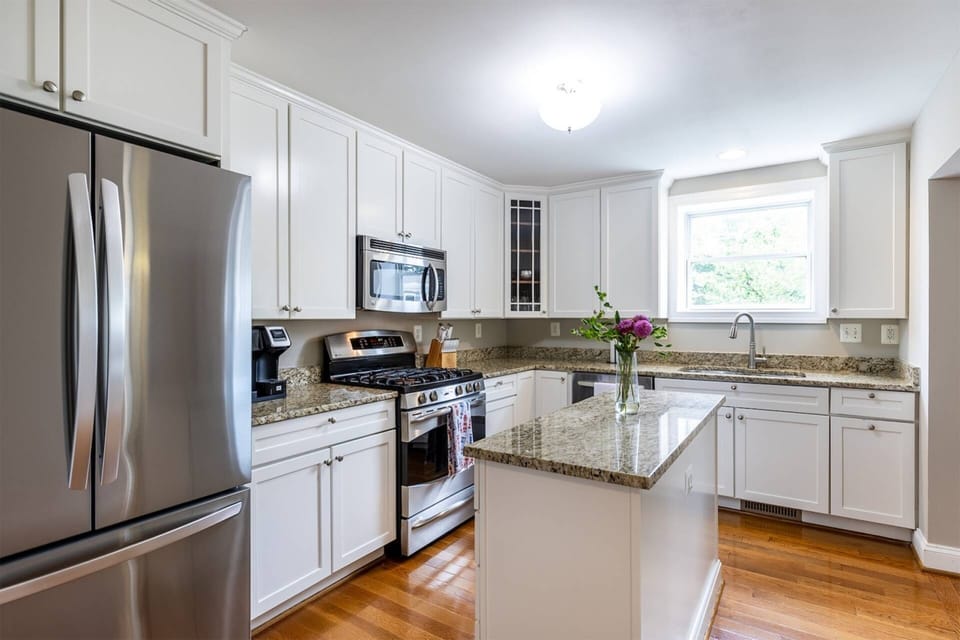 The gourmet kitchen sits at the center of the home.