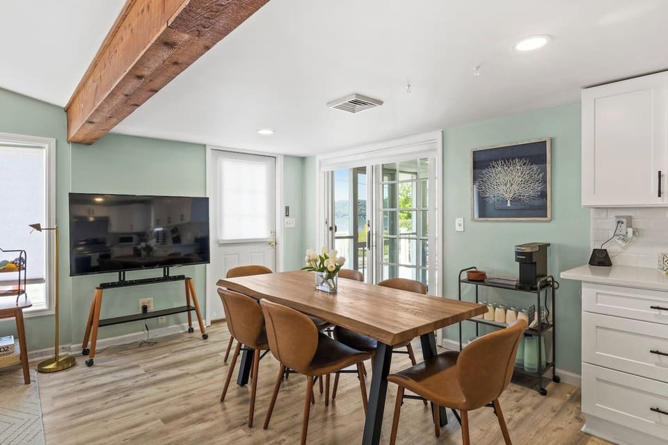 Cozy dining area  with a large table and stylish decor, perfect for memorable meals. ️