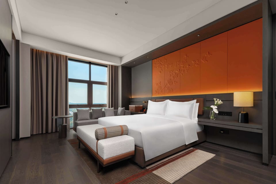 Deluxe Suite, 1 King Bed | Down comforters, in-room safe, desk, laptop workspace