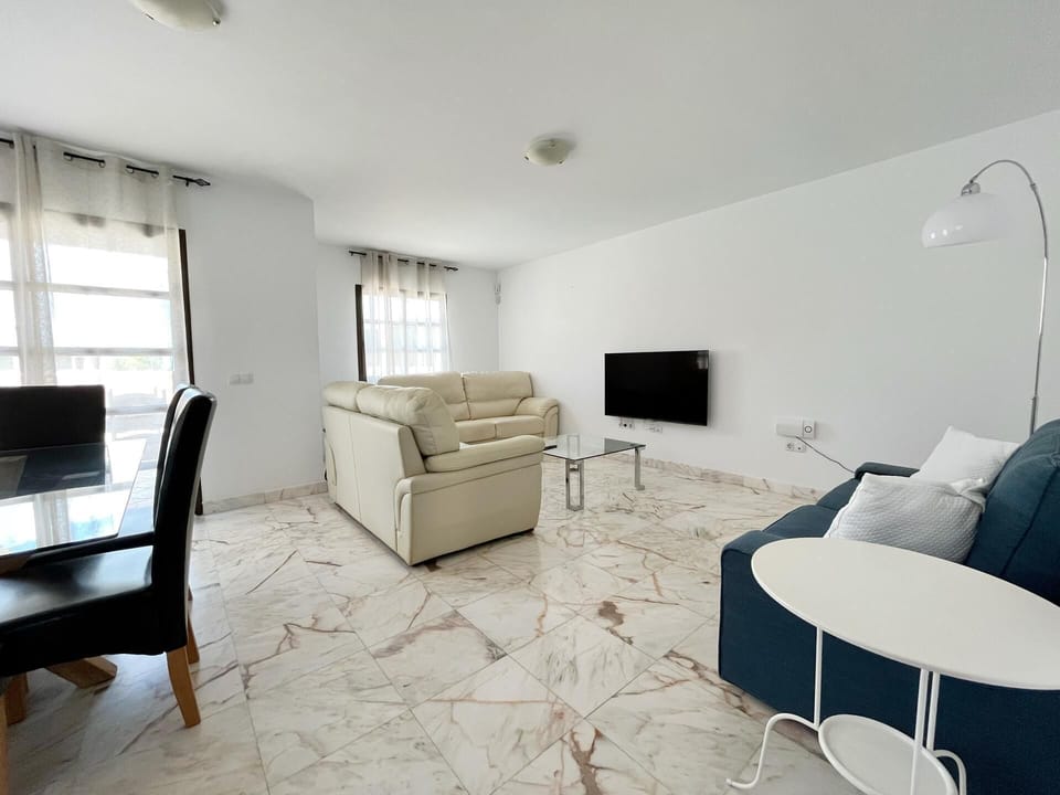 Villa | Living area | TV, fireplace