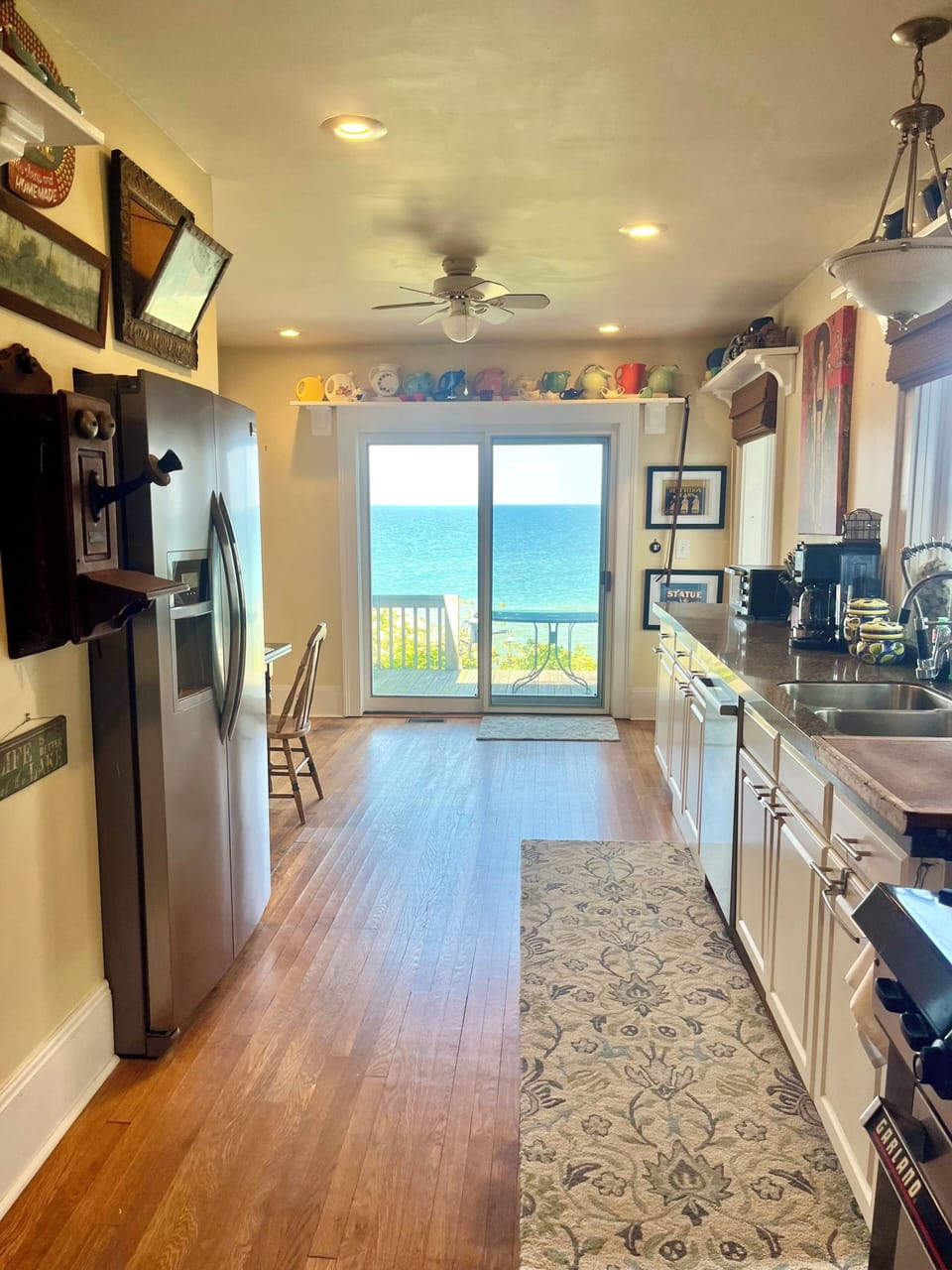 Kitchen slider and back deck overlooks Lake Erie. Eat b’fast & dinner lakeside!