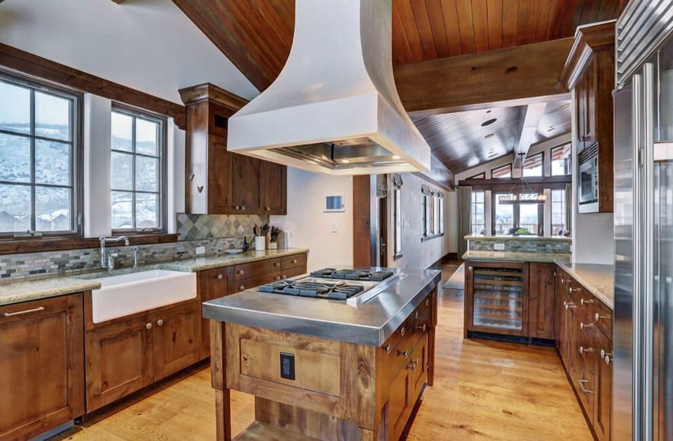 Channel your inner chef in the gourmet kitchen, equipped with high-end appliances, granite countertops, and a spacious layout perfect for preparing delicious meals.