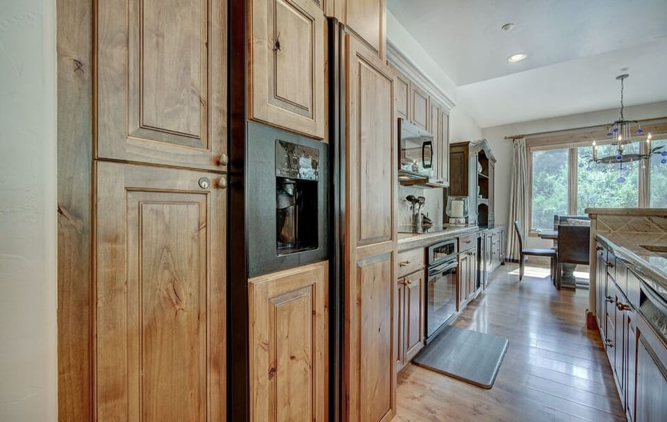 Prepare meals in the well-equipped kitchen, boasting plenty of storage, high-end appliances, and a bright, airy atmosphere.
