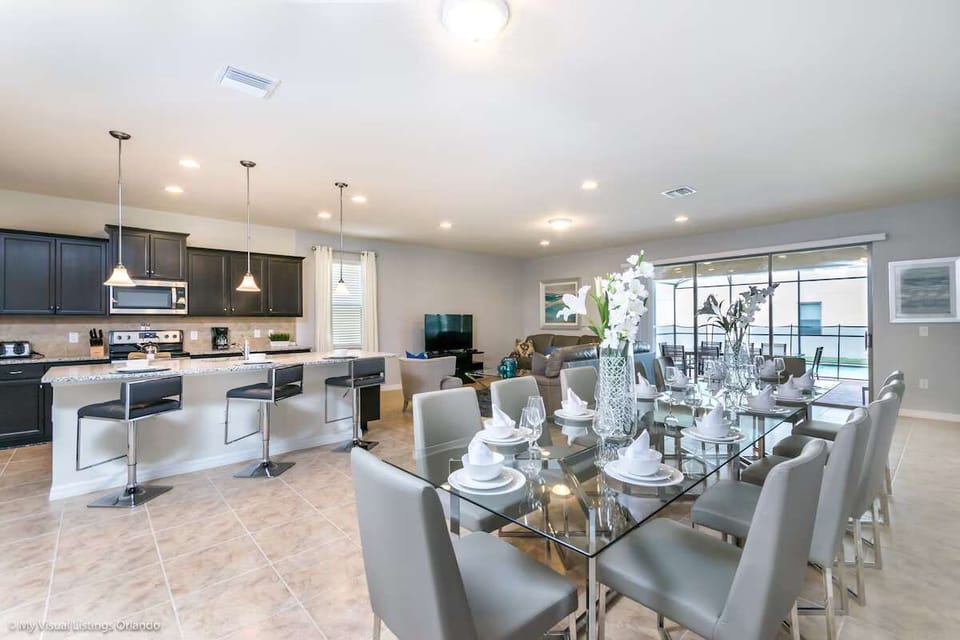Spacious open-concept home with a modern kitchen, dining for 10 & pool access