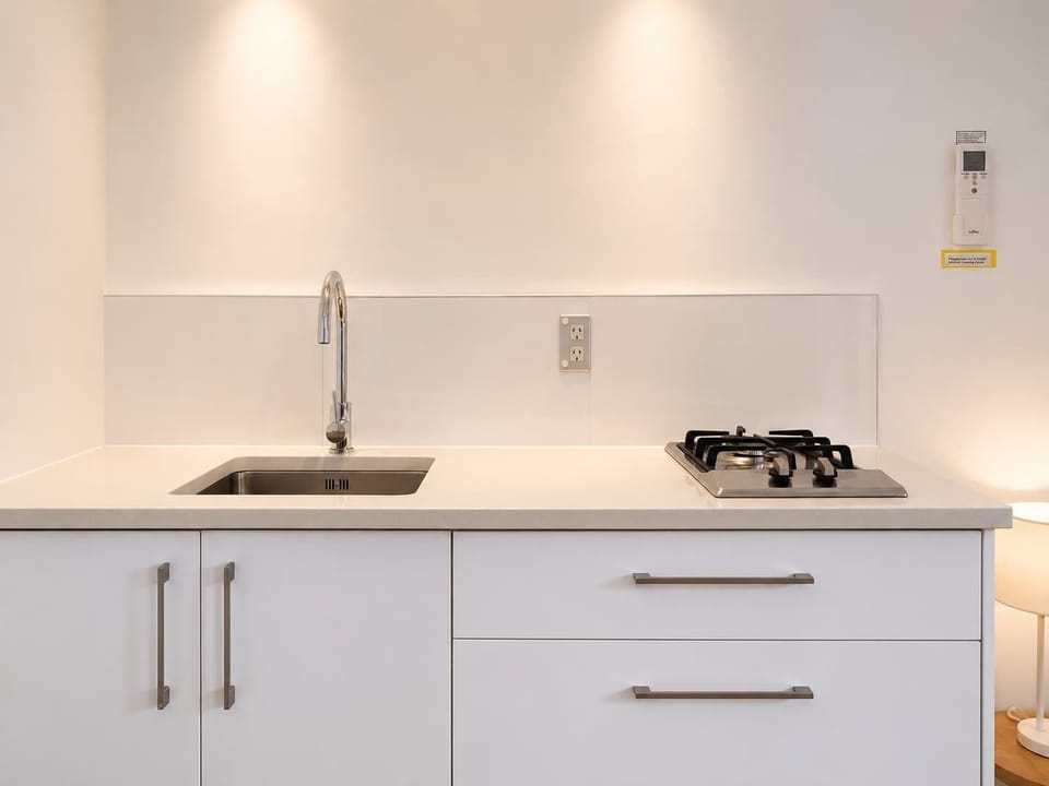 Kitchenette with  two gas hobs, microwave, and Nespresso coffee machine 