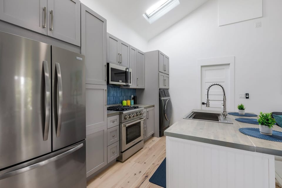 gas stove, full sized fridge plus beverage fridges