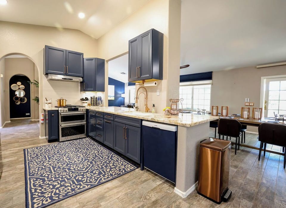 Kitchen with GE CAFE gas cooktop, griddle, dbl oven. Sink with RO water filter