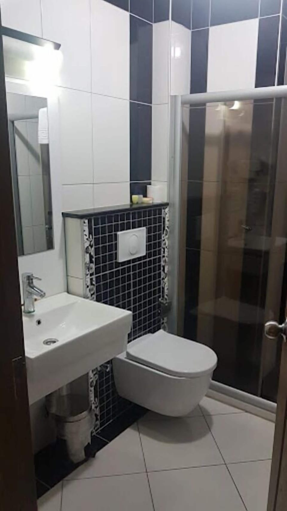 Shower, hair dryer, slippers, towels