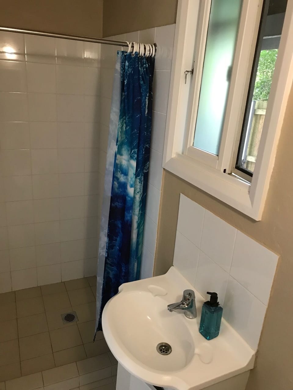 Shower, basin & toilet in bathroom