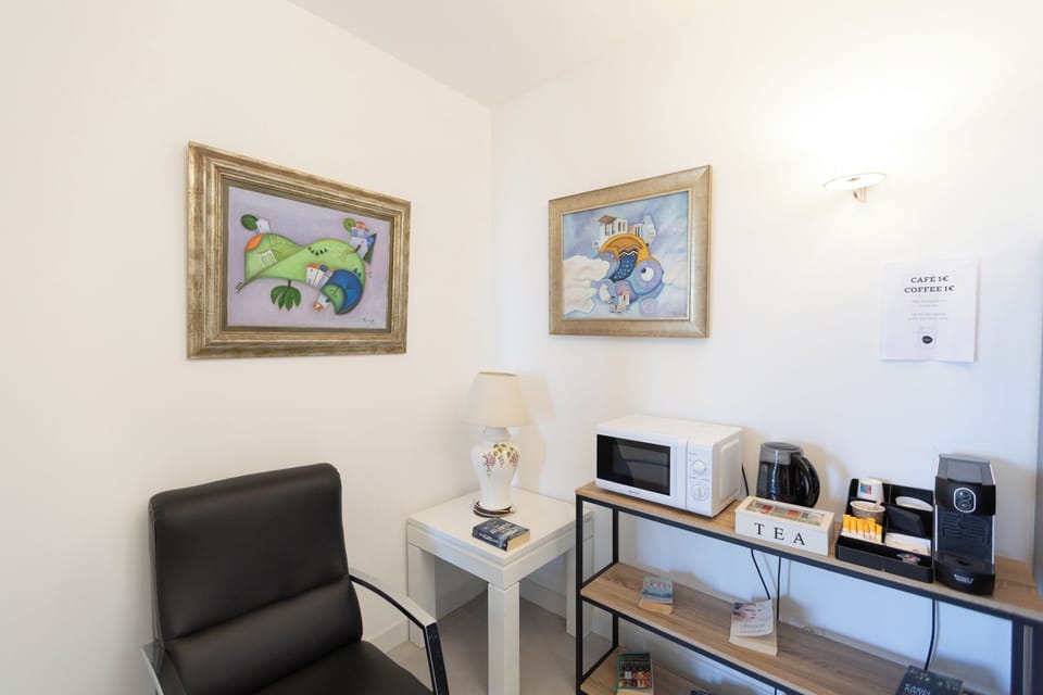 Comfort Triple Room | Living area | 32-inch LCD TV with digital channels