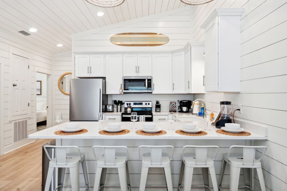 Five barstools provide ample seating for guests to gather, dine, and enjoy great company.