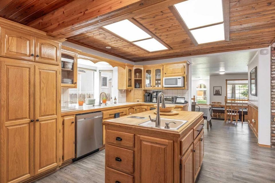 The wood cabinets and ceilings give the space a warm and inviting feel.