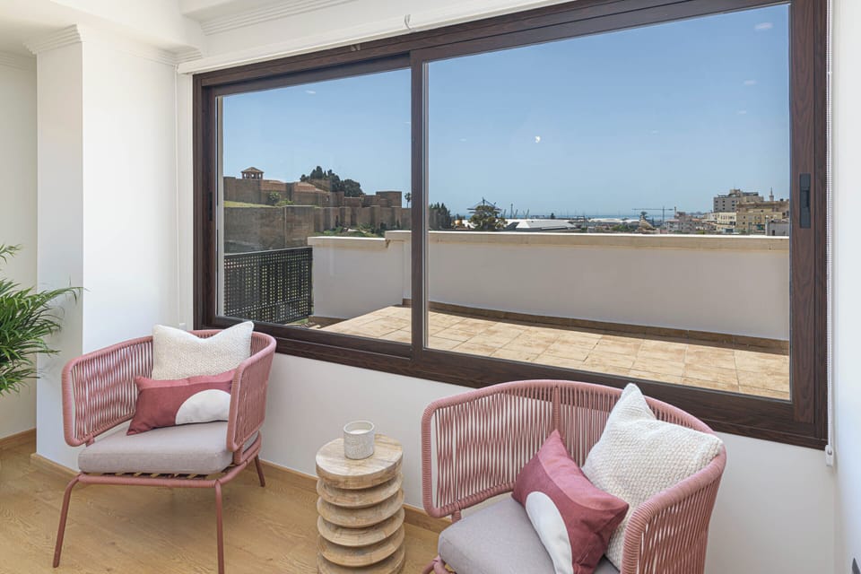 Deluxe Penthouse, City View | Living area | 50-inch TV with cable channels