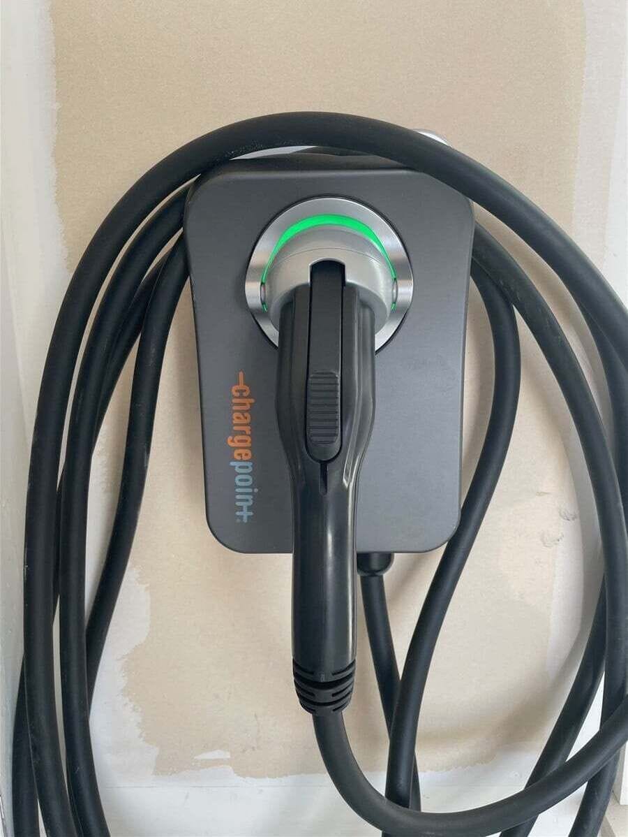Electric Vehicle Plug In.   You must bring an adapter to charge Teslas
