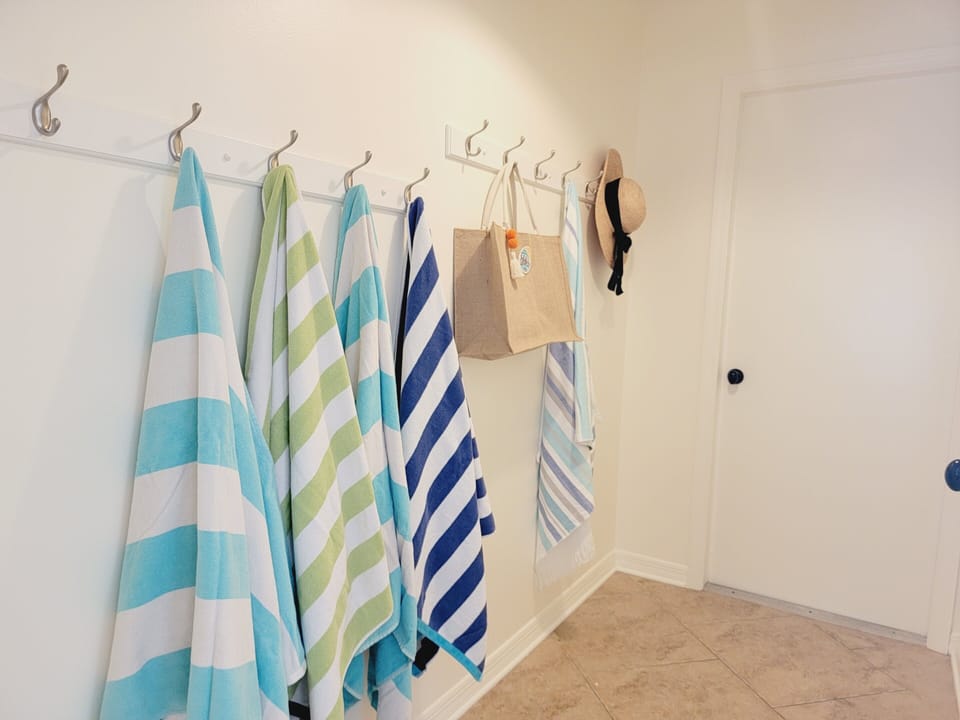 Hallway to laundry and garage has space to unload your beach gear