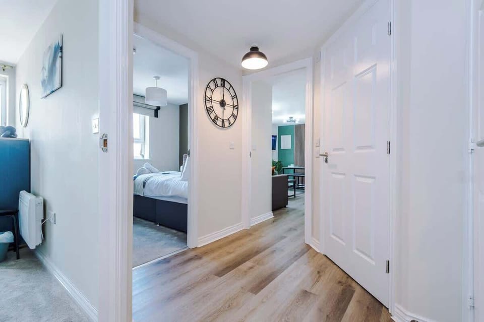 The entrance hallway leads to both bedrooms, the open planing living area and the main bathroom.