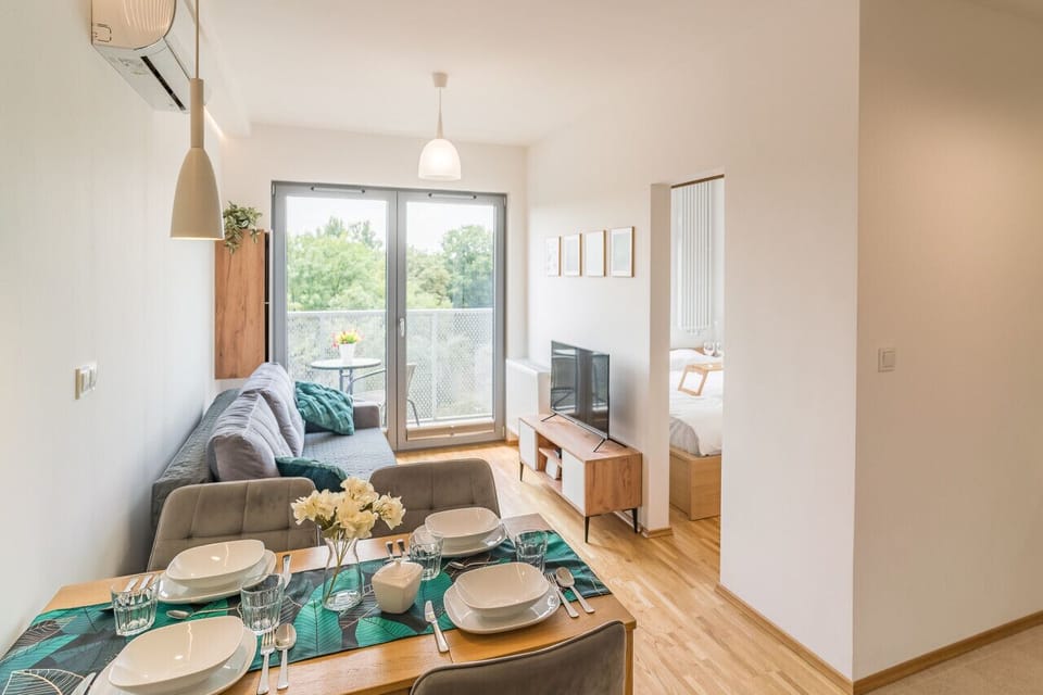 Comfortable Living Room with Sofa Bed and Smart TV | Book Now with RENTUJEMY